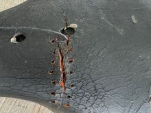 After poking holes with the awl and starting the first stitch 