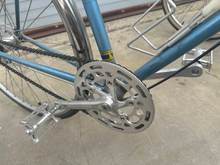MKS touring next pedals, NOS Sedis chain, VO stainless fenders (are kinda too wide though for 700c x 25 Continental GP's), original Sakae cranks. I filed the teeth off a 54T Sugino chain ring to make a sort of chain guard.