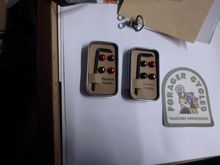 Two tins of four.  They come with extra screws because the screws are always hiding once they hit the floor!    