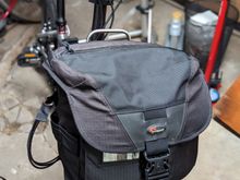 An old camera bag slides perfectly on the vertical part of the rack. I used it to pick up Italian roasted coffee beans and mozzarella balls the other day.