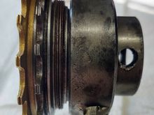 7. Next the Stop is threaded into the main body of the tool. My rod broke and I use a round Phillips screw driver blade to tighten the Stop against the freewheel body.