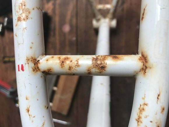 Frame not pretty but no dings nor holes. The rust should clean off with white vinegar and kitchen roll.