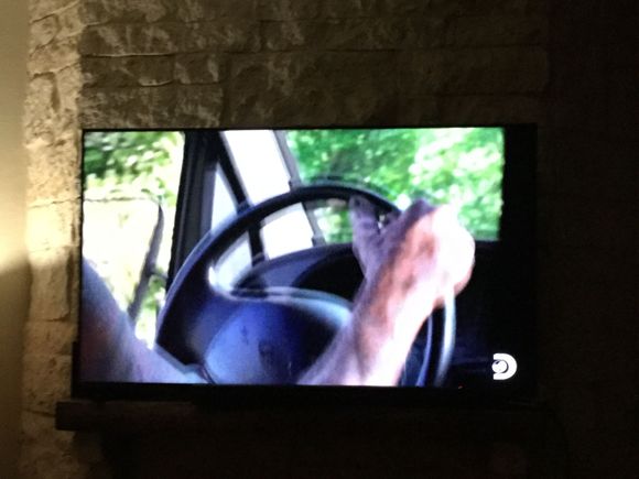 TV just sits on mantle over never used fireplace nothing holding it just sits there. No problems unless massive earthquake LOL then the TV is the last of my worries. 