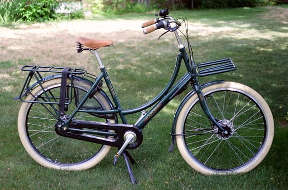 8 speed IGH, oversided roller brakes, frame lock, full fender protection, lights, dynamo front hub, dual legged kickstand, rear rack, front rack supported off frame so as not to effect handling, etc.  