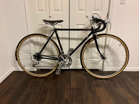 Lugged Light High Tension Steel Tubing. Heavy but perfect for a city commuter/rainy day bike.