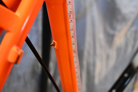 I measured from the center of the seat tube top tube junction.  The housing stop on the seat stay for the for the RD  