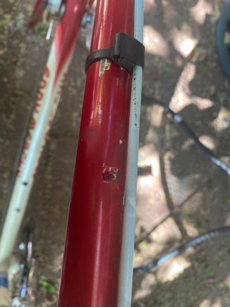A cable guide on the top tube is broken 