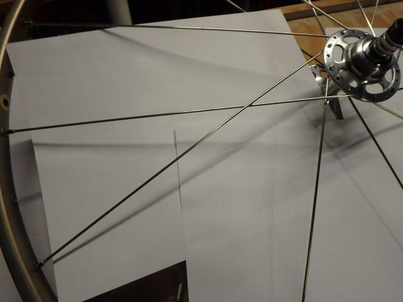 The spoke is in place with the spoke placed two holes from the spoke from the first step, or the pulling spokes. 