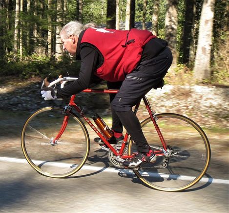 The heavy vest is RED the bike is burnt OANGE