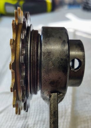 7. Next the Stop is threaded into the main body of the tool. My rod broke and I use a round Phillips screw driver blade to tighten the Stop against the freewheel body.