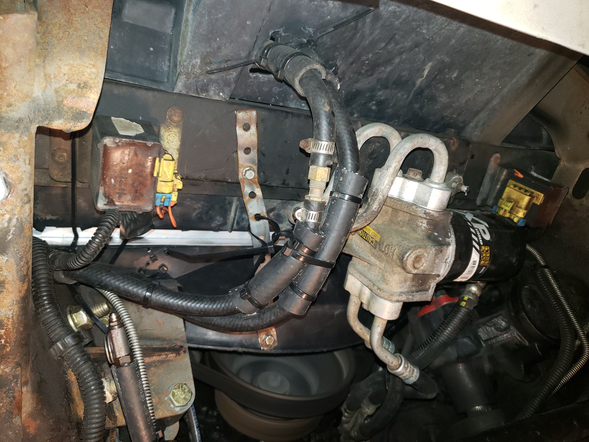 Another view of the extra transmission cooling lines. The slivery metal strap is what I had used to secure the lower fan shroud with the earlier ECP radiator. I likely didnt need it but it was easier to reuse than remove.
