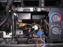 After about an hour of tearing out the plastic behind the head unit, there is finally enough room for the double din to sit flush with the AC controls
