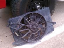 Taurus fan... Came out of a 3.0, has the 3.0 shroud, but it's a two speed with more fins than any other 3.0 I've seen. It fit very nicely against the radiator and moves a ton of air so I'm happy