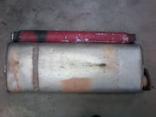 Stock muffler on bottom and current one on top.