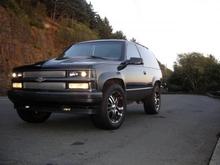 My Tahoe as see in this pic, Volant cold air feeding a Whipple Industries supercharger, marine intake manifold, tuned Ceramic Bassani followed by Volant 2 into 1, 3''. 20'' Incubus Paranormals wrapped with Hankook Ventus ST 245/40ZR20s. Goodmark cowl Hood, Eclipse CD-5444, 6.5'' MB corts all round and a 1400 watt pioneer ultra slim powered by old phoenix gold. two gauge A pillar with white face autometer phantom boost, exhaust temp and fuel air in the overhead console. Second color interior accents.  Black APC Projector Headlights speed grill, smoked tails second color side markers all trim shaved. Poly bushings Edelbrock Performer IAS shocks. Not shown front indicators smoked.