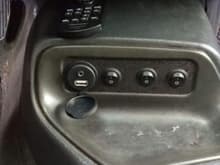 Removed cassette deck and replaced with custom made switch panel.  You can also see the AUX port with 3.5mm audio and USB mounted in the panel.