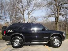 the 2002 zr2 (replacing the totaled 2000 zr2)

i've since added PIAA ion fog lights, cold air intake, rain shields, tow hitch, bf goodrich ta/ko all terrains, high output alternator(110-220amp), optima red top battery, 50w PA system, clarion touch screen, 3-way and 4-way 220 watt pioneers, 2 12" kicker L7's, rockford 1100 watt punch, capacitor, sound responsive blue lightning neon in rear window slants and blue plasma tube on subs, and a larger exhaust tip. i love that it has a sunroof! 

lots of repairs- radiator, front hub assemblies, new tires, new exhaust system, fuel pump,  distibutor cap, O2 sensor, manifold gasket, and catalytic converter(3x under warranty thank god). at 165,000 miles if i had the money after all this, i'd get a cowl hood, 3 inch lift with 33's and dual exhaust. i spend too much money keeping it going, but i love it.