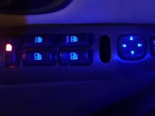 The missing switch is the &quot; lockout switch&quot; and is the last one of these controls and probably the biggest pain to get it to look good. I decided to put a red led in it like the doors lock switch so I can tell whats what a little easier at night . Other than that most lights are going blue.