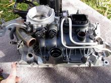 Upper and Lower Intake Manifolds ~ I didn't seperate them while replacing the Lower Intake Manifold ( LIM ) gasket.  When putting it in place for final installation, make sure you get the fuel lines aligned, before threading the intake bolts.
A little off subject, but before connecting the heater core hoses ... I recommend you back flush your heater core.