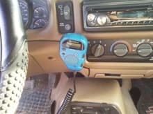 Cobra C.B. radio with remote (hidden) body (under driver's seat).  All controls (volume, channel, squelch, p.a., em. ch.9, and readout) are on the mic.  Compact and kinda cool I think.