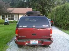 I have a two inch body lift with lifter springs producing about 4 inches in the rear.  Still have to fabricate the trailer hitch to lift the bumper back up to the body.  Single 125 inch whipper, still have to reinstall the other one. Got Mud?, FRBR, NRA and Smith and Wesson stickers.  Chrome tip on the tail pipe.  Still have to smoke out the tail lights.