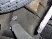 Looking up at rear shock mount mount extension to allow use of OE self-leveling shocks and special ZW7 rear leaf springs