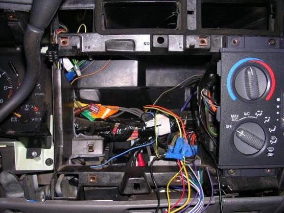 After about an hour of tearing out the plastic behind the head unit, there is finally enough room for the double din to sit flush with the AC controls
