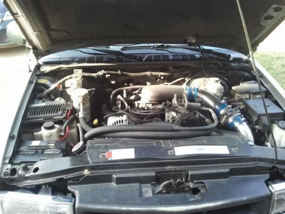 Amp is wired to the battery (on the left)