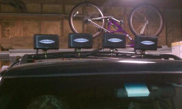 Light rack, 220 watts of auxiliary lighting. Bought the lights for $23 a pair from Walmart and made the rack out of a cross bar from a scape yard I got for $10. Like daylight when I turn this thing on!
