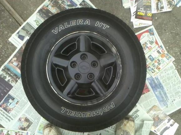 Here's one the stock OEM rims. Plastidipped black