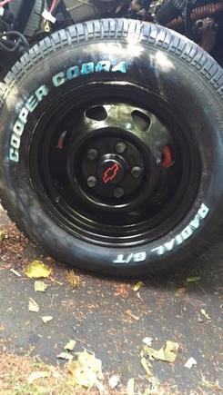 Painted the factory 15" steel rims and center caps, and mounted them on 235/65r15 Cooper Cobra GTs