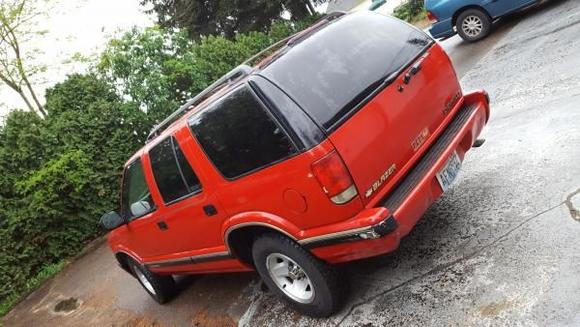 Rear view. Damage from rear-end collision is visible. Mostly bumper.