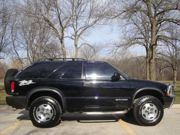 the 2002 zr2 (replacing the totaled 2000 zr2)

i've since added PIAA ion fog lights, cold air intake, rain shields, tow hitch, bf goodrich ta/ko all terrains, high output alternator(110-220amp), optima red top battery, 50w PA system, clarion touch screen, 3-way and 4-way 220 watt pioneers, 2 12" kicker L7's, rockford 1100 watt punch, capacitor, sound responsive blue lightning neon in rear window slants and blue plasma tube on subs, and a larger exhaust tip. i love that it has a sunroof! 

lots of repairs- radiator, front hub assemblies, new tires, new exhaust system, fuel pump,  distibutor cap, O2 sensor, manifold gasket, and catalytic converter(3x under warranty thank god). at 165,000 miles if i had the money after all this, i'd get a cowl hood, 3 inch lift with 33's and dual exhaust. i spend too much money keeping it going, but i love it.