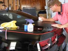 Me installing flat black rally stripes and getting ready to install Havok rear spoiler and remove single red pinstripe and go dual red pin stripe.