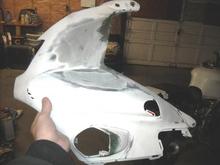 this is th left head fairing where the bike was dropped and put a big hole in the plastic. hole no longer there