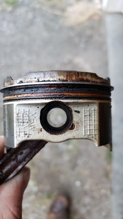 piston was stuck in the bore due to the varnished fuel and stuck rings. thankfully it didnt mess up the walls on the way out.