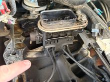 In this photo I was just pointing at a clean spot. It is because this fuel pressure regulator is bad. I have the manifold off to replace the fuel injector spider. You can see how dirty it is. I think there is even a little oil in some spots. 