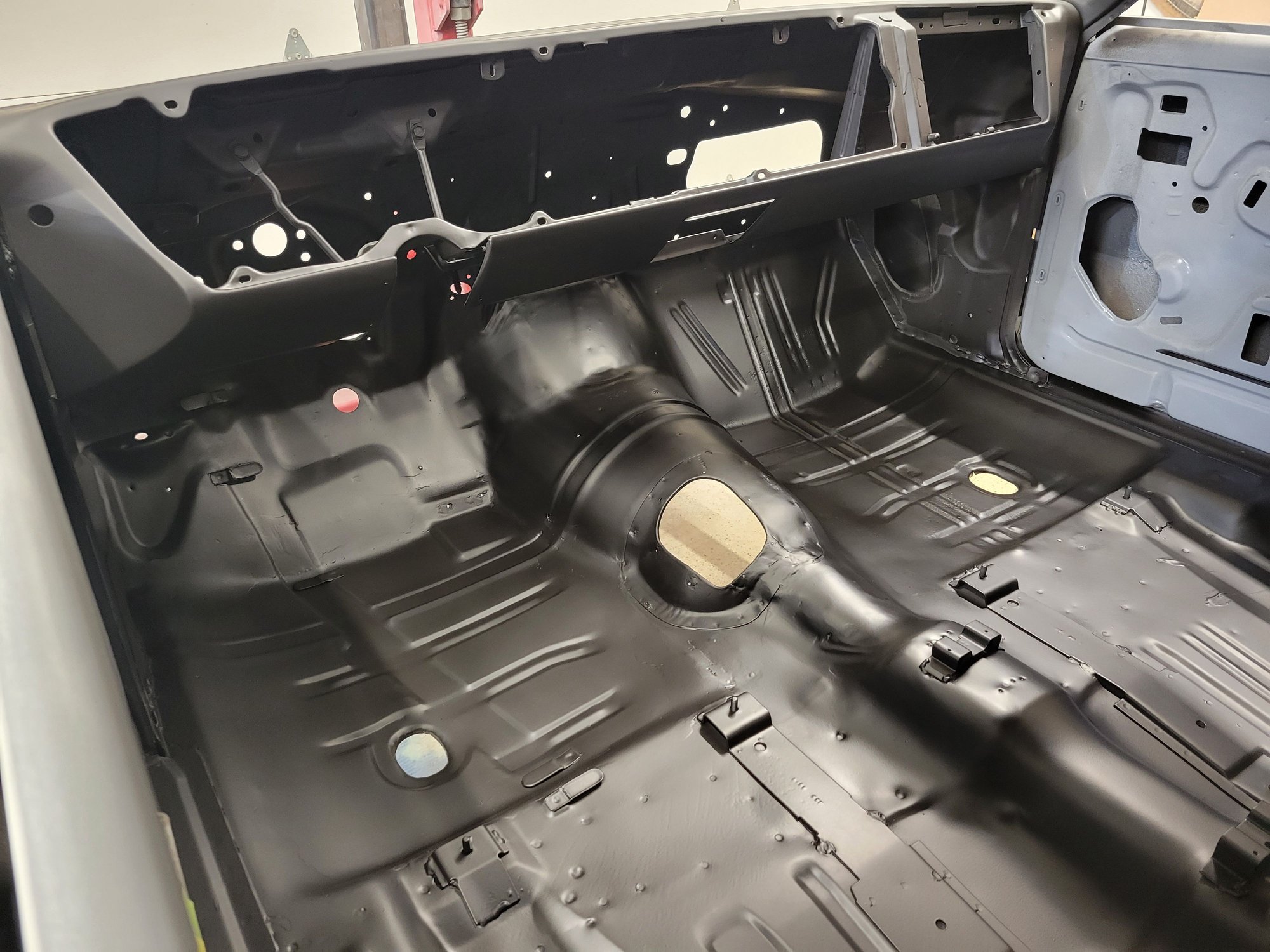 Heres a photo of my 67 442 with the factory cutout for manual transmission. 
