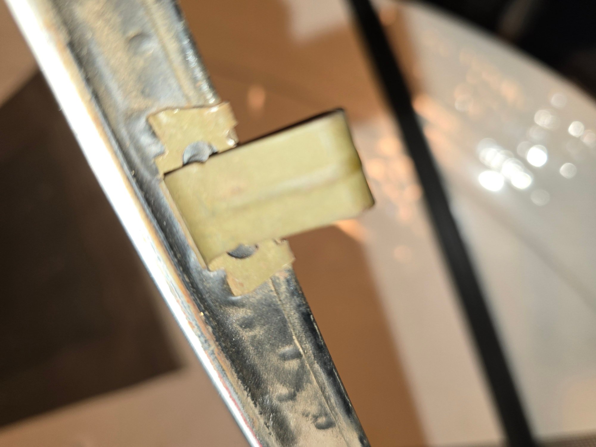 Removed, this is the beltline trim clip still attached to the trim, from the outside of the trim- the side you dont see until you remove it.