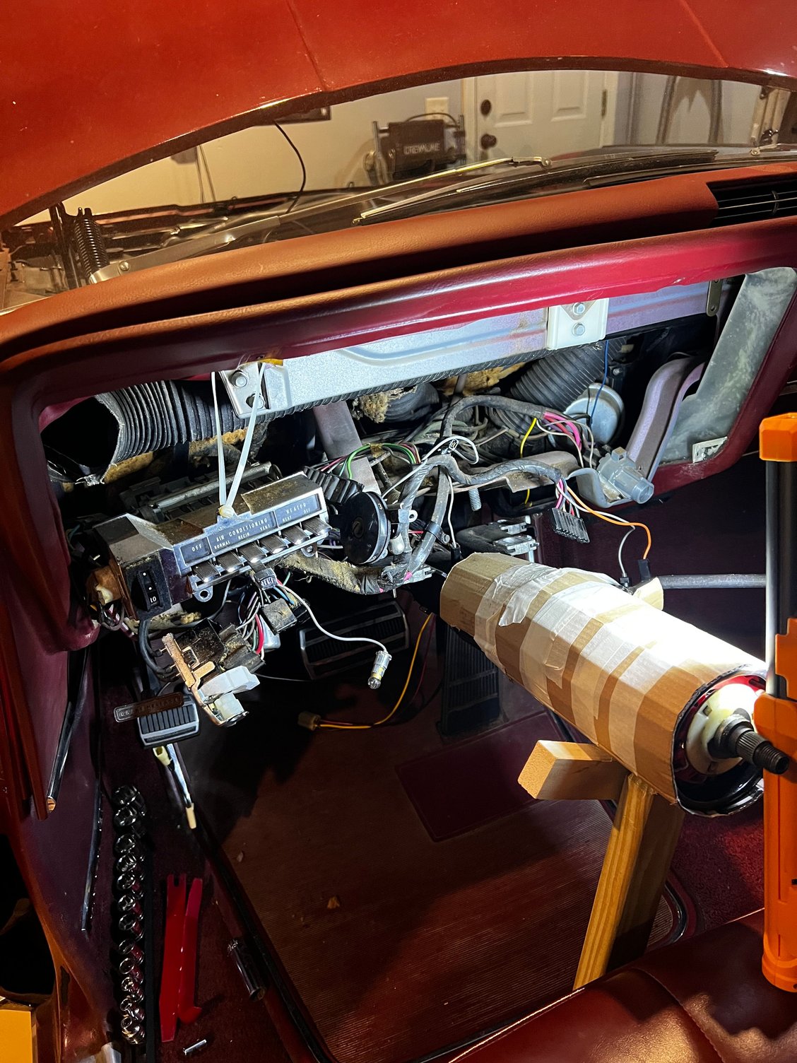 I hung the heater controls from a zip tie to take the pressure off the control cable. 