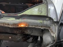 What panel would this be is this considered trunk floor? Tail light panel?. You can see in the picture I am shining a light so you can see the light through the rust holes I’m referring about 