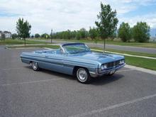 Another shot of a rare survivor Oldsmobile.  This was my dad's third Oldsmobile.  He had a 1950, 1955, and this 1962.  This car was a daily driver from 1965 - 1976.  Our family even used it in winter time.  Despite the convertible top, it was very warm inside!!