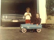 Thats me in the peddle car, my sister and my car watching over me in the garage, sometime around 1970