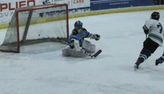 Gabe shot over the Goalie's right shoulder, and the puck is buried in the upper left corner of the net.