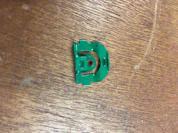 Green fixed depth clip. Used in rear glass. AMK part number B-10838