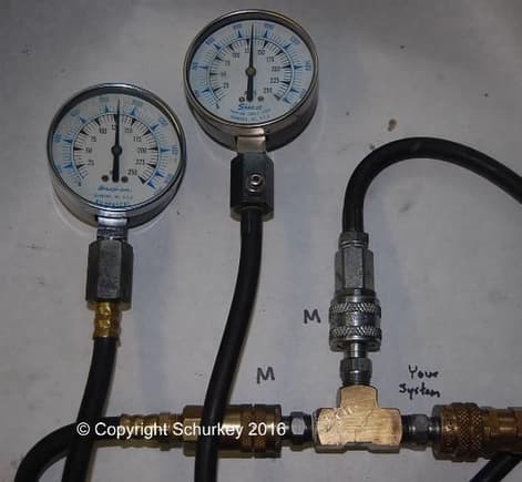 Two compression testers showing almost identical readings.  Also matches compressed-air regulator (not shown.)