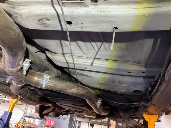 Why not drop a bolted on exhaust?  Probably because I’d spend more time dinking with that than just working around it.  Cleaning the tight space above the drive shaft was fun too.