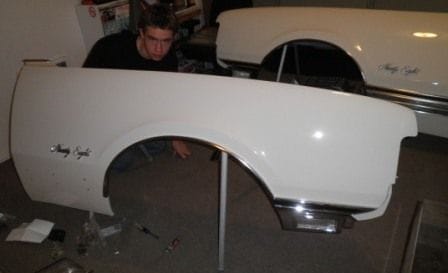Reassembing the front clip...all NOS trim, molding and lamps