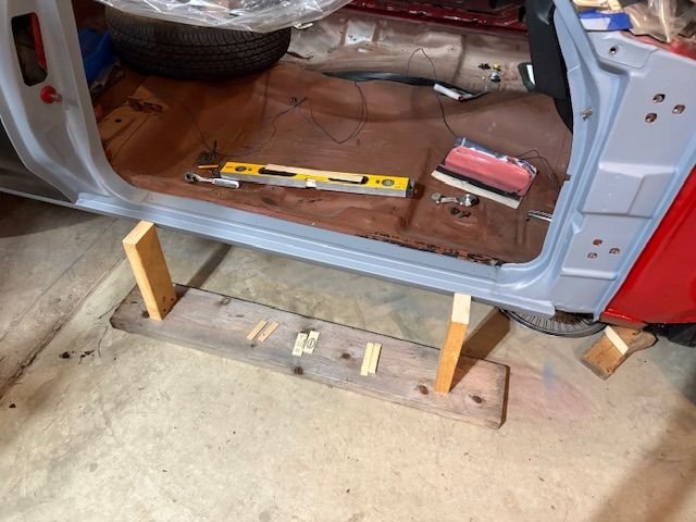 A door base supporting fixture.  May or may not be helpful.  Some shims of various thicknesses 