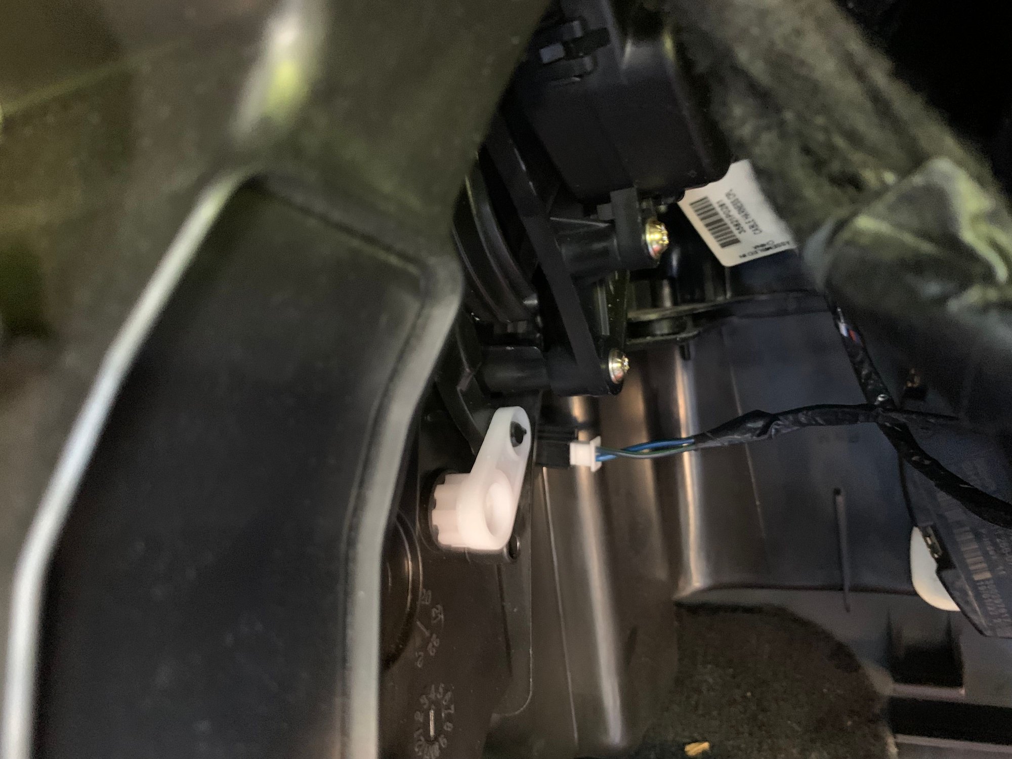 If you look close, this is the lower actuator on passenger side. It got the vents to blow more air when it was replaced, but it still blows warm on the passenger side. There is supposed to be one more actuator on the passenger side, and Im hoping its the passenger side blend door actuator. 